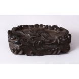A CHINESE MOULDED WAVE STAND, in the form of crashing waves, 12cm wide x 5.5cm.