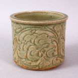 A CHINESE LONGQUAN CELEDON CARVED POTTERY BRUSH WASH, carved with stylised flora, 8.5cm high, 10cm