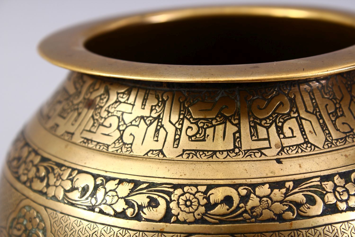 A GOOD ISLAMIC BRASS TRIPLE FOOT CALLIGRAPHIC BOWL, with panels of figures and bands of calligraphy, - Image 7 of 9