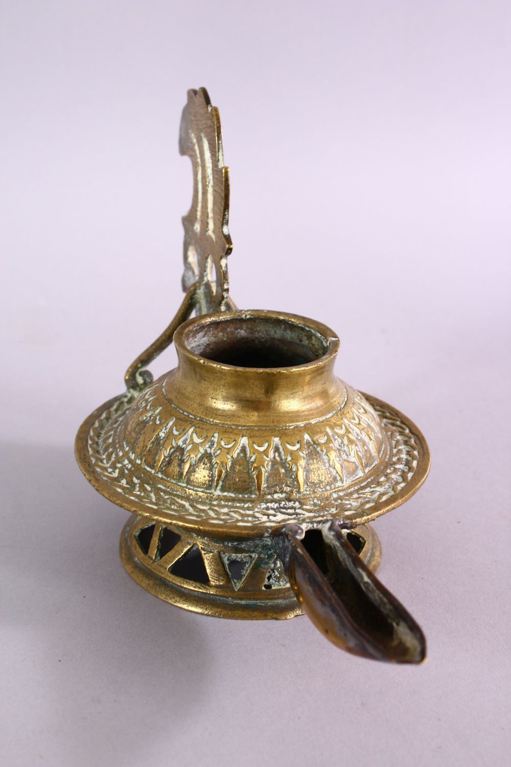 AN UNUSUAL EARLY ISLAMIC POSSIBLY ANDALUSIAN SPANISH BRASS OIL LAMP, with moulded decoration, 17cm - Image 2 of 6