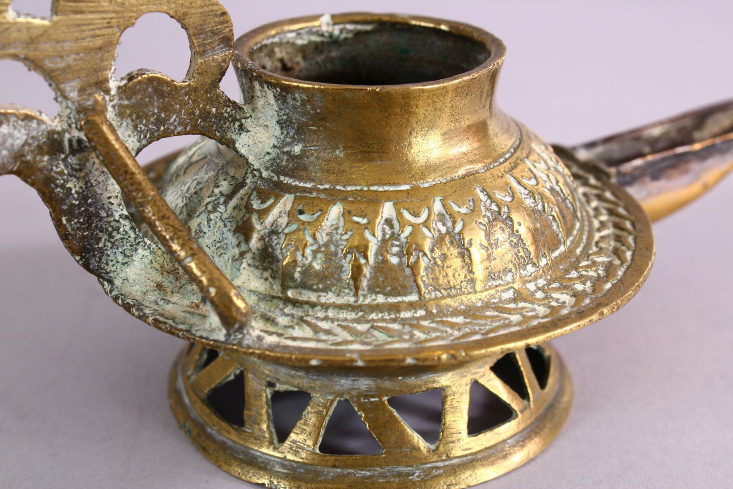 AN UNUSUAL EARLY ISLAMIC POSSIBLY ANDALUSIAN SPANISH BRASS OIL LAMP, with moulded decoration, 17cm - Image 4 of 6