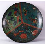 A LARGE 19TH CENTURY ORIENTAL CLOISONNE CHARGER, with tri-sectional decoration of birds and flora,