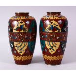 A PAIR 20TH CENTURY JAPANESE CLOISONNE VASES, red ground with panels of birds and flowers, 15cm