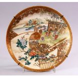 A FINE JAPANESE MEIJI PERIOD SATSUMA PLATE, decorated with panel views of figures in landscapes,