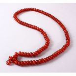 A CHINESE AGATE BEAD NECKLACE, the bead approx 8mm diameter.
