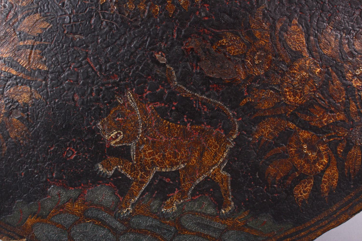 A FINE 18TH/19TH CENTURY INDIAN PAINTED LACQUER LEATHER SHIELD, decorated with a band of tigers, - Image 2 of 10