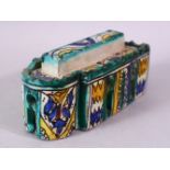 A PERSIAN PAINTED POTTERY INKSTAND AND COVER, the interior with six pen holders and an inkwell, 16cm