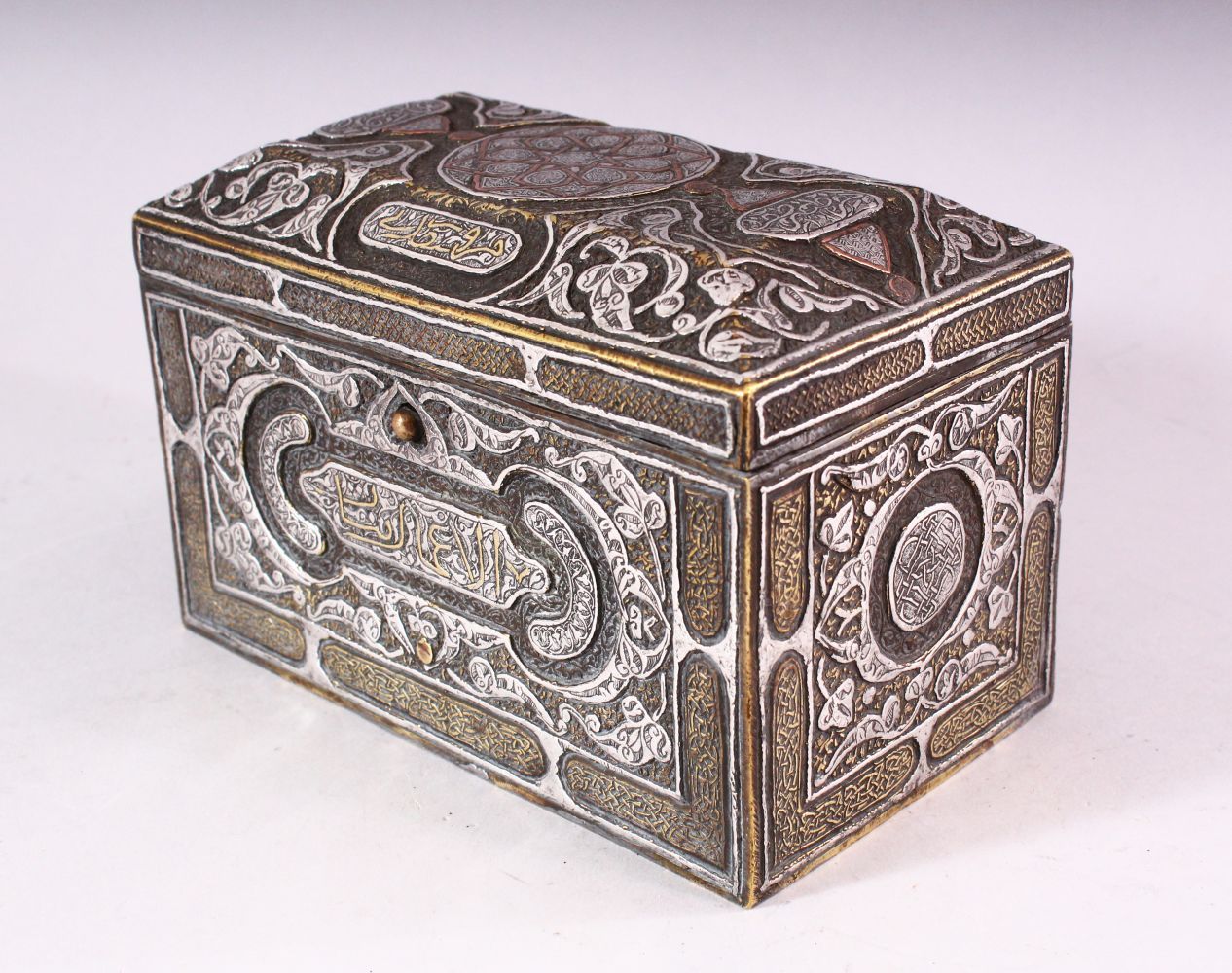 A GOOD 19TH CENTURY SYRIAN SILVER, COPPER AND BRASS RECTANGULAR CASKET, with panels of calligraphy