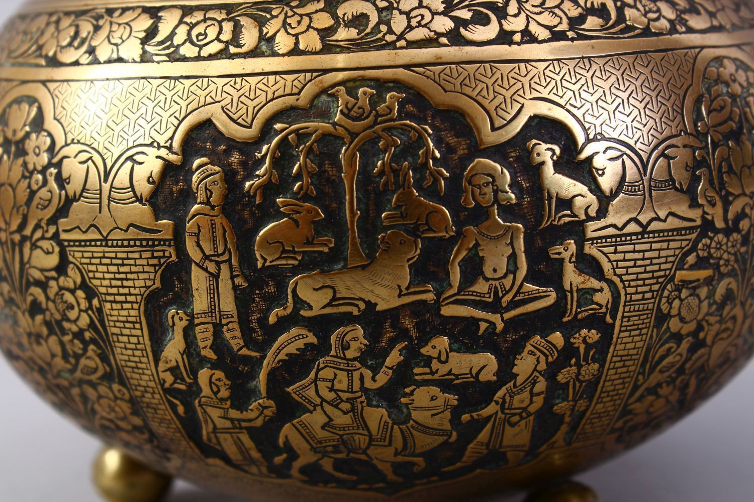 A GOOD ISLAMIC BRASS TRIPLE FOOT CALLIGRAPHIC BOWL, with panels of figures and bands of calligraphy, - Image 8 of 9