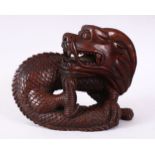 A 19TH / 20TH CENTURY CHINESE CARVED HARDWOOD FIGURE OF A INTERTWINED DRAGON, 18cm wide x 14cm.