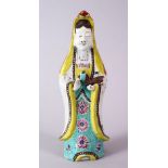 A 19TH CENTURY FAMILLE ROSE PORCELAIN FIGURE OF GUANYIN, with floral decoration, 23.5cm high.