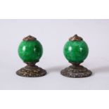 A PAIR OF CHINESE CARVED HARDSTONE & METAL FINIAL / TOPS, the finial each with a nice green carved