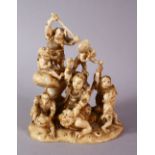 A JAPANESE MEIJI PERIOD CARVED IVORY OKIMONO GROUP - depicting figures attacking oni demons, one dog