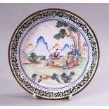 A 19TH / 20TH CENTURY CHINESE WHITE ENAMEL DISH, the dish decorated with scenes of figures seated in