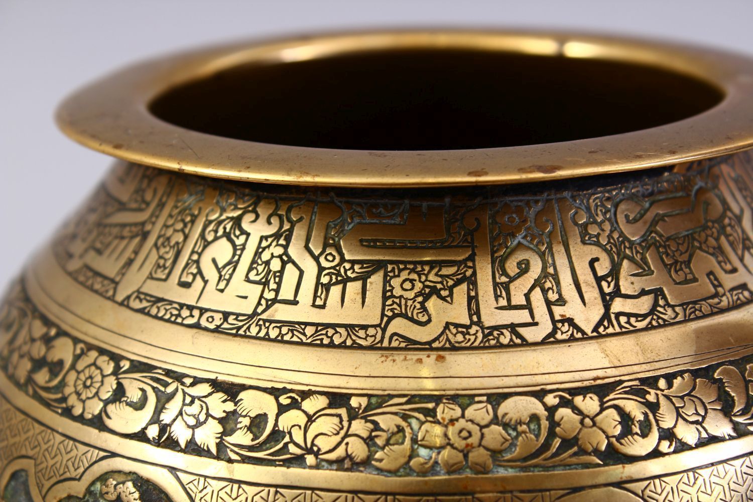 A GOOD ISLAMIC BRASS TRIPLE FOOT CALLIGRAPHIC BOWL, with panels of figures and bands of calligraphy, - Image 5 of 9