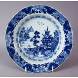 A 19TH CENTURY CHINESE WILLOW PATTERN SOUP BOWL, (AF), 23cm diameter.