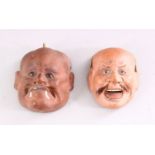 TWO MINIATURE JAPANESE PAINTED PLASTER NOH MASKS, 6cm and 6.5cm high.