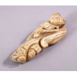 A SMALL 19TH CENTURY CHINESE SOAPSTONE NETSUKE OF A MAN, 7cm.