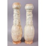 A PAIR OF POSSIBLY HAN DYNASTY TALL 'SOUL' VASES, with bulbous rim, the neck moulded with figures,