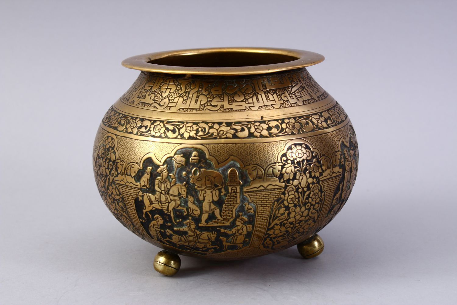 A GOOD ISLAMIC BRASS TRIPLE FOOT CALLIGRAPHIC BOWL, with panels of figures and bands of calligraphy, - Image 2 of 9