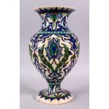 A TURKISH KUTAHIYA BALUSTER SHAPED VASE, painted in the Iznik style, 32cm high.