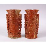 A PAIR OF 19TH CENTURY CHINESE CARVED SOAPSTONE POSEY VASES, Each carved with dragins and