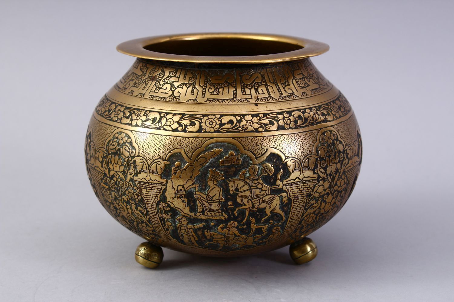 A GOOD ISLAMIC BRASS TRIPLE FOOT CALLIGRAPHIC BOWL, with panels of figures and bands of calligraphy, - Image 3 of 9