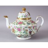A 19TH / 20TH CENTURY CHINESE CANTON FAMILLE ROSE PORCELAIN TEAPOT, decorated with sprays of