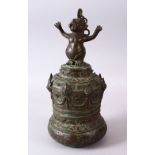 AN EARLY INDONESIAN BRONZE TEMPLE BELL, the top with a mythical beast finial and hanging chain,