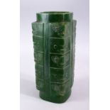 A CHINESE CARVED JADE STYLE ARCHAIC CONG VASE, with carved archaic decoration, 29.5cm high.