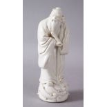A 19TH/20TH CENTURY CHINESE BLANC DE CHINE PORCELAIN FIGURE of an immortal, 14cm high.