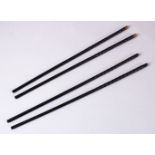 TWO PAIRS OF CHINESE CARVED EBONY CHOPSTICKS, each carved and one set with metal tops, both 29cm.