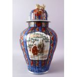 A LARGE IMARI VASE AND COVER, the ribbed body painted with panels of flowers and figures, the