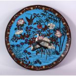 A JAPANESE MEIJI PERIOD CLOISONNE DISH, decorated with scenes of craned in water amongst bamboo,