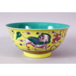 A CHINESE FAMILLE JAUNE QIANLONG STYLE PORCELAIN LION DOG BOWL, decorated upon a yellow ground