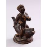A SMALL CHINESE BRONZE FIGURE OF A BOY SEATED UPON A CARP, 15cm high.