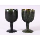 A GOOD PAIR OF MUGHAL CARVED SPINACH GREEN JADE GOBLETS, 10cm high X 5.6cm diameter