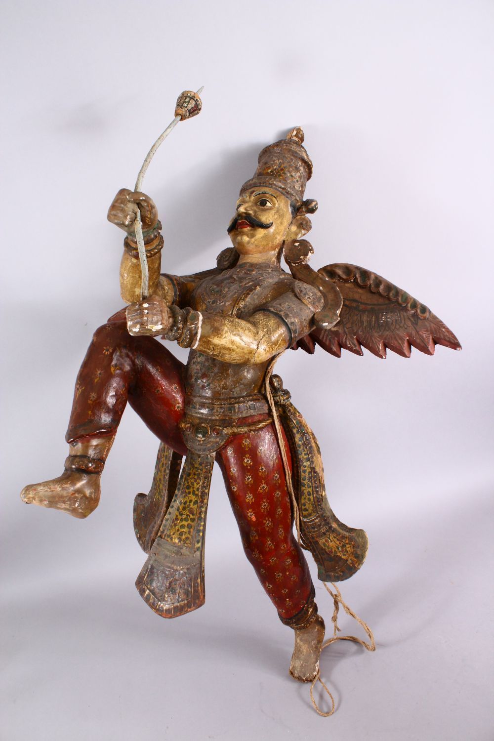 A 19TH CENTURY INDIAN / BURMESE CARVED WOOD FIGURE OF A WINGED GOD, stood holding an implement, with - Image 4 of 5