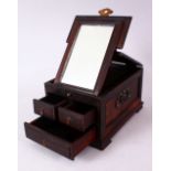 A CHINESE HARDWOOD SMALL DRESSING TABLE BOX, with folding mirror and three small drawers, 17cm deep,