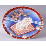 A JAPANESE MEIJI PERIOD IMARI PORCELAIN MOULDED CAT PLATE, with raised decoration of a cat upon a