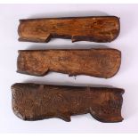 THREE INDIAN CARVED WOODEN SPICE BOXES, largest 40cm long.