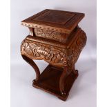 A LARGE JAPANESE MEIJI / TAISHO PERIOD CARVED WOODEN STAND, the top carved with chrysanthemum, the