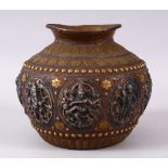 AN INDIAN COPPER BULBOUS SHAPED VASE, the body onlaid with silver panels of Indian gods, within