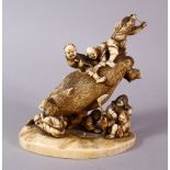 A JAPANESE MEIJI PERIOD CARVED IVORY OKIMONO GROUP- depicting a boar being attacked by numerous