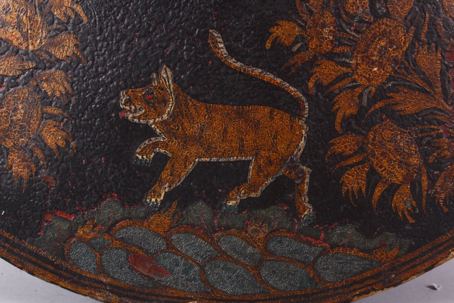 A FINE 18TH/19TH CENTURY INDIAN PAINTED LACQUER LEATHER SHIELD, decorated with a band of tigers, - Image 6 of 10