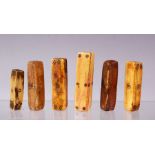 A COLLECTION OF SIX 16TH-18TH CENTURY INDIAN IVORY AND BONE GAMING DICE, the longest 8.5cm.