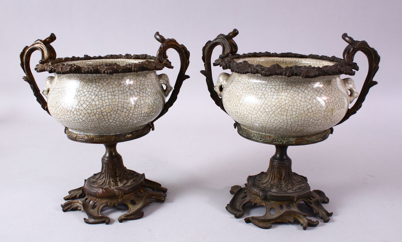 A PAIR OF 19TH/20TH CENTURY CHINESE GUAN WARE POTTERY BOWLS with ormolu mounts, the bowls with