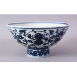 A CHINESE MING STYLE BLUE & WHITE PORCELAIN BOWL, decorated with roundel depicting lotus and
