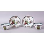 A PAIR OF CHINESE FAMILLE ROSE TEA BOWLS AND SAUCERS, decorated with figures.