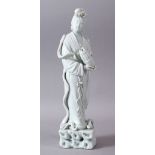 A GOOD 19TH/20TH CHINESE BLANC DE CHINE PORCELAIN FIGURE OF GUANYIN, holding an vessel, 33cm high.
